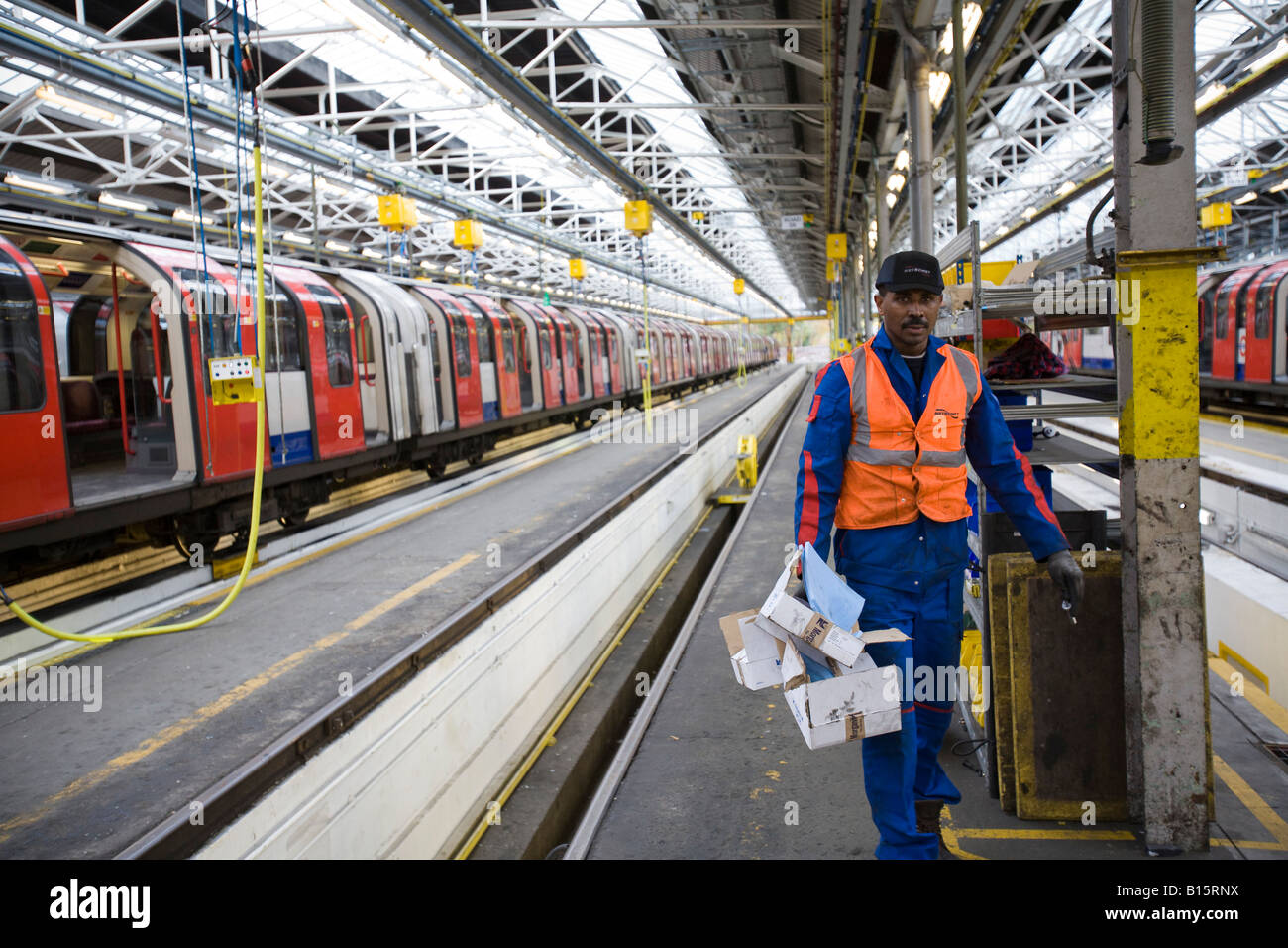 A engineer works on maintaining tube trains at Hainault depot
