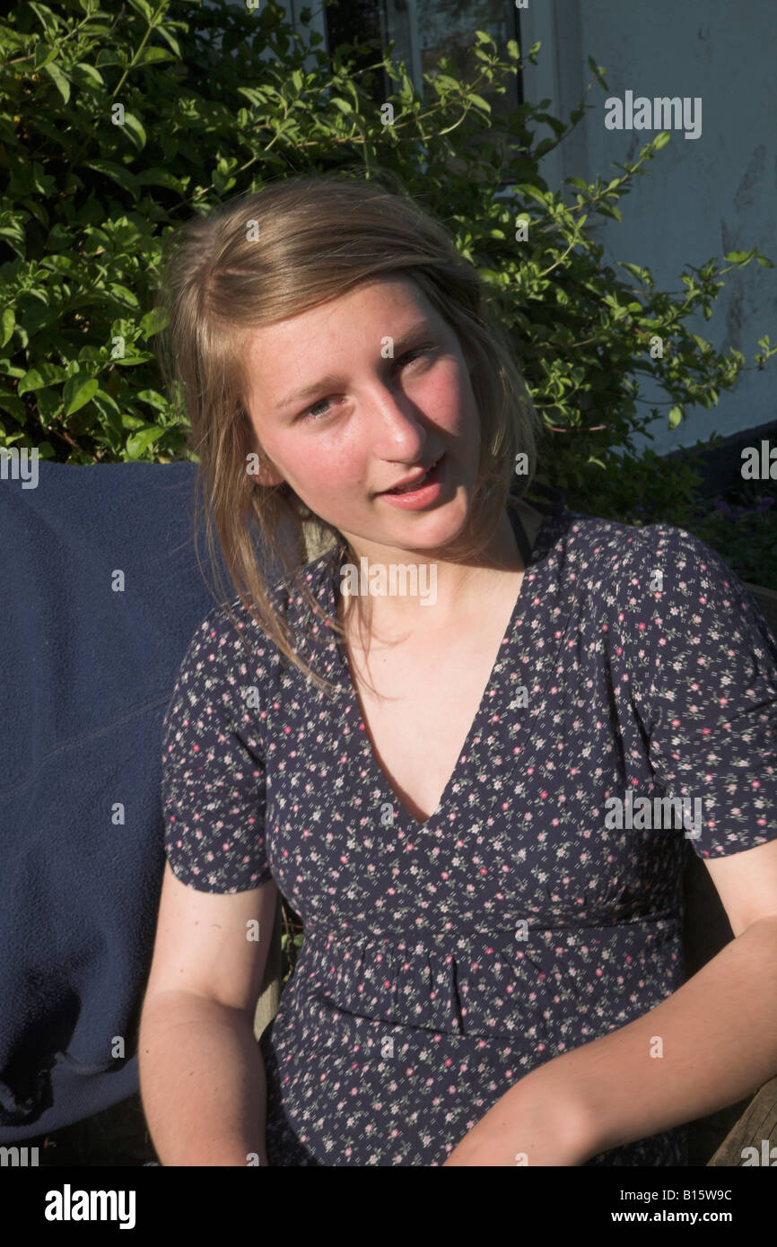 Teenage girl portrait wearing flowery dress Stock Photo - Alamy