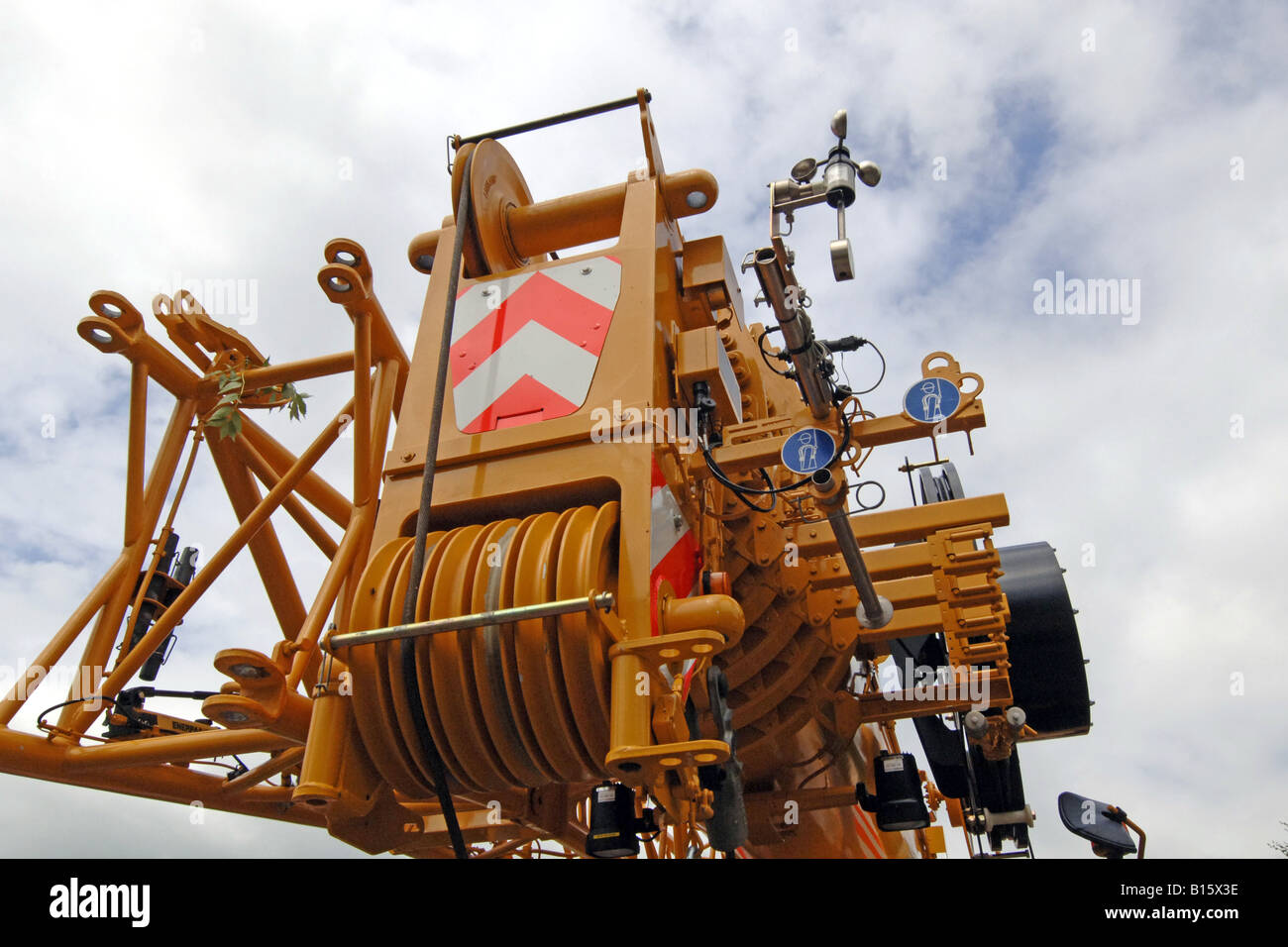 The winch and pulley system on the top of a telescopic mobile crane