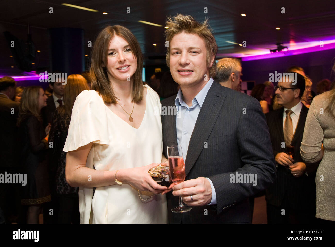 Jamie Oliver celebrity chef poses for his portrait with his wife Jools Oliver in London Stock Photo