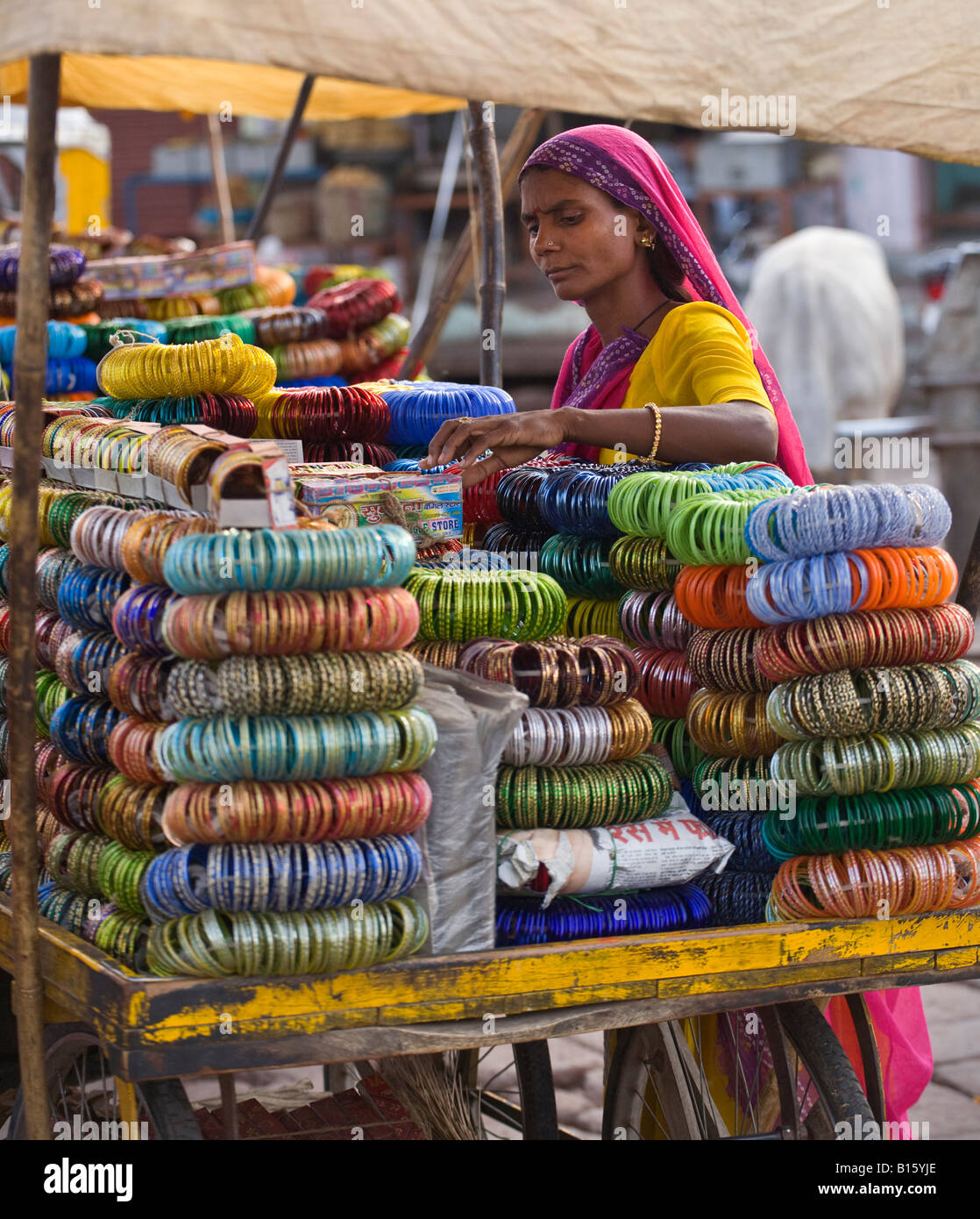 A RAJASTHANI WOMAN sells BRACELETS in JODHPUR also known as the BLUE CITY RAJASTHAN INDIA Stock Photo