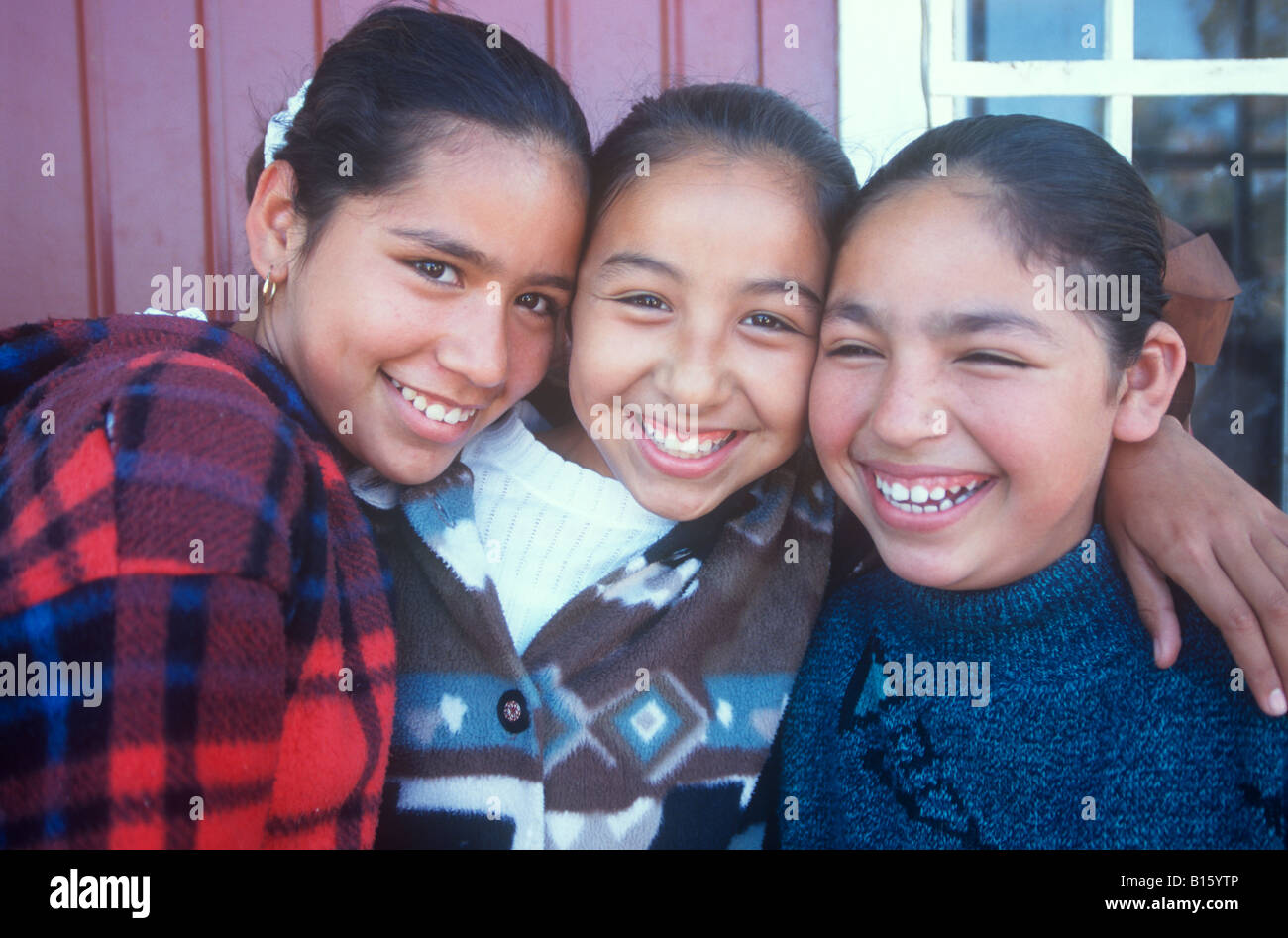 Three Hispanic girlfriends smiling. Stock Photo