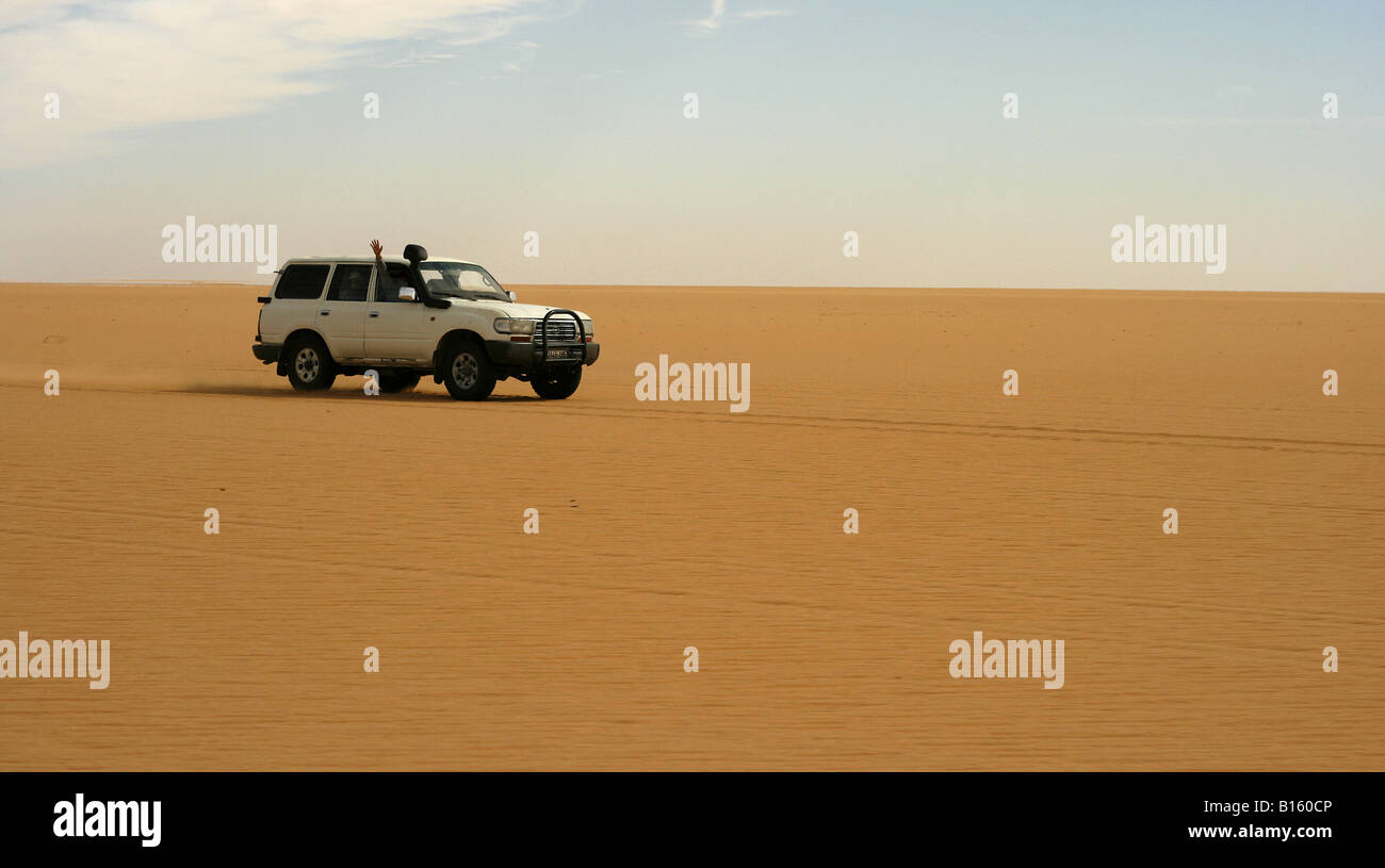 4x4 car driving by Tassili Ahaggar Sahara desert Algeria Stock Photo ...