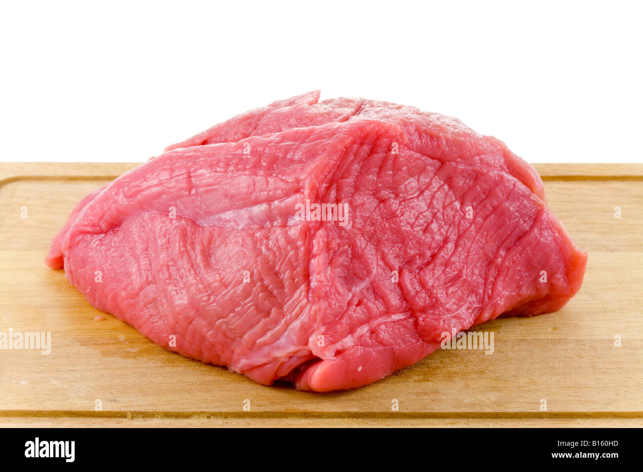 raw beef on wood board isolated on white background Stock Photo - Alamy