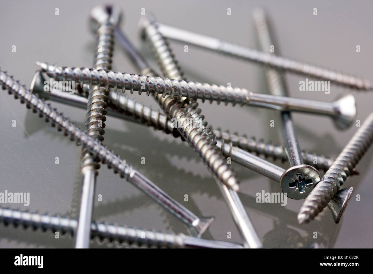 Detail of numerous screws used for wood, drywall, wallboard, or other construction. metal screws