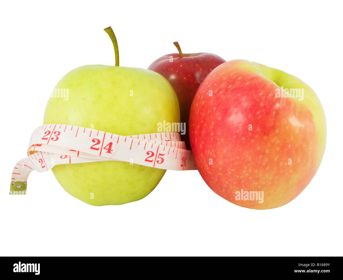Diet concept with different apples and a measure tape in inches (model waist measure length in tape) Stock Photo