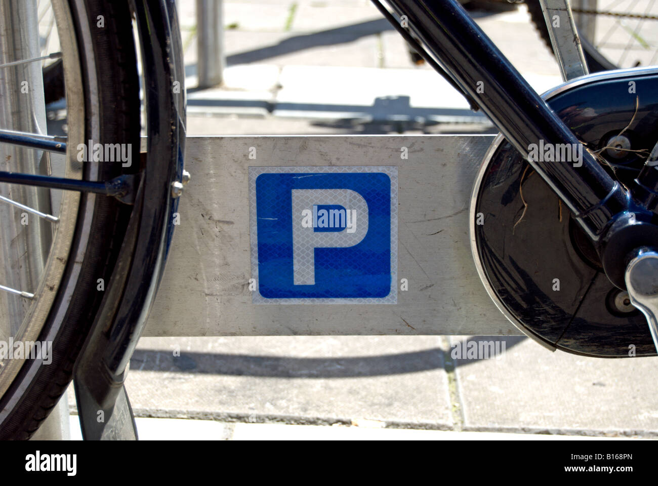 cycle parked at a council rack with cycle parking sign, in kingston