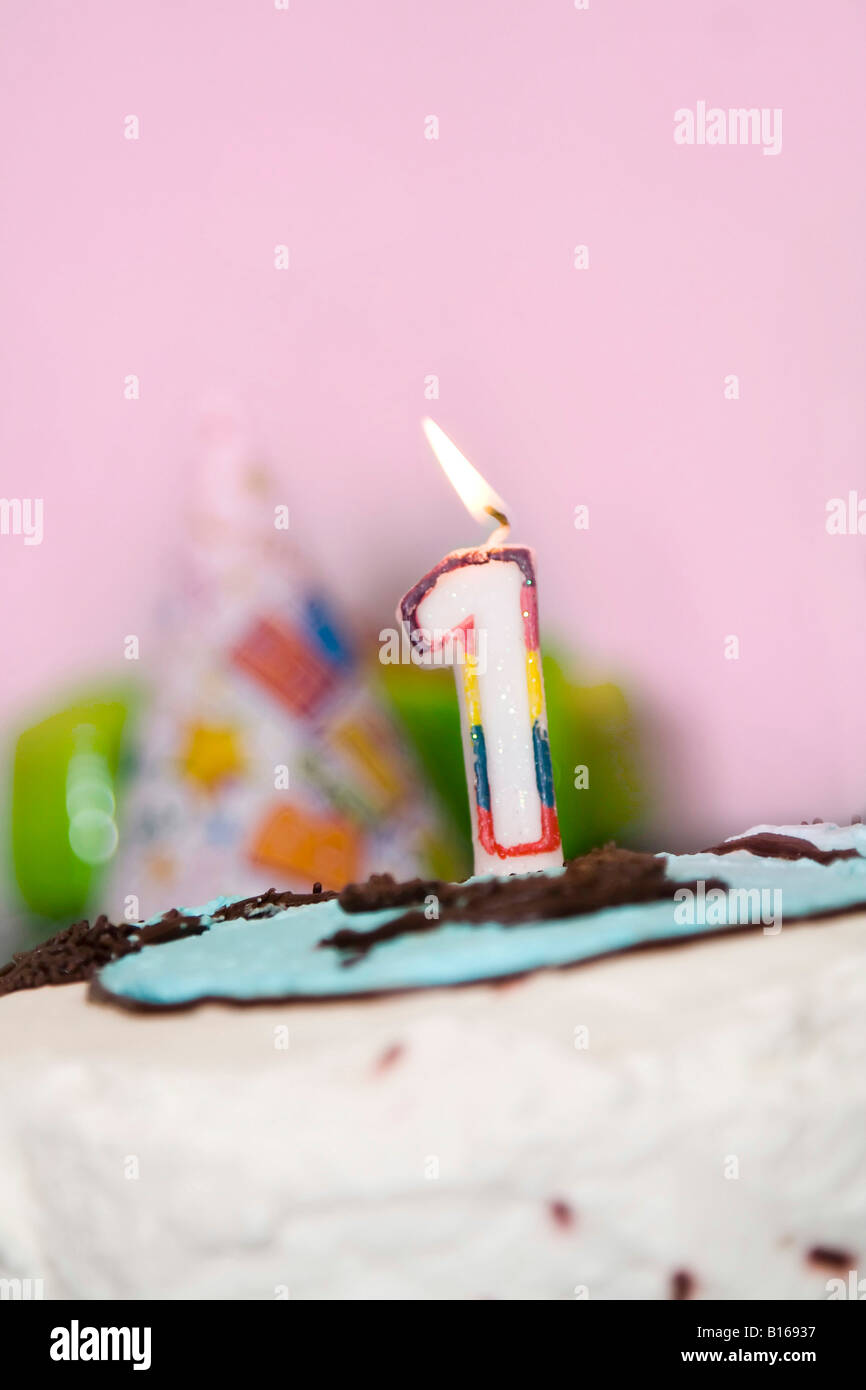 Birthday cake with a candle close up Stock Photo - Alamy