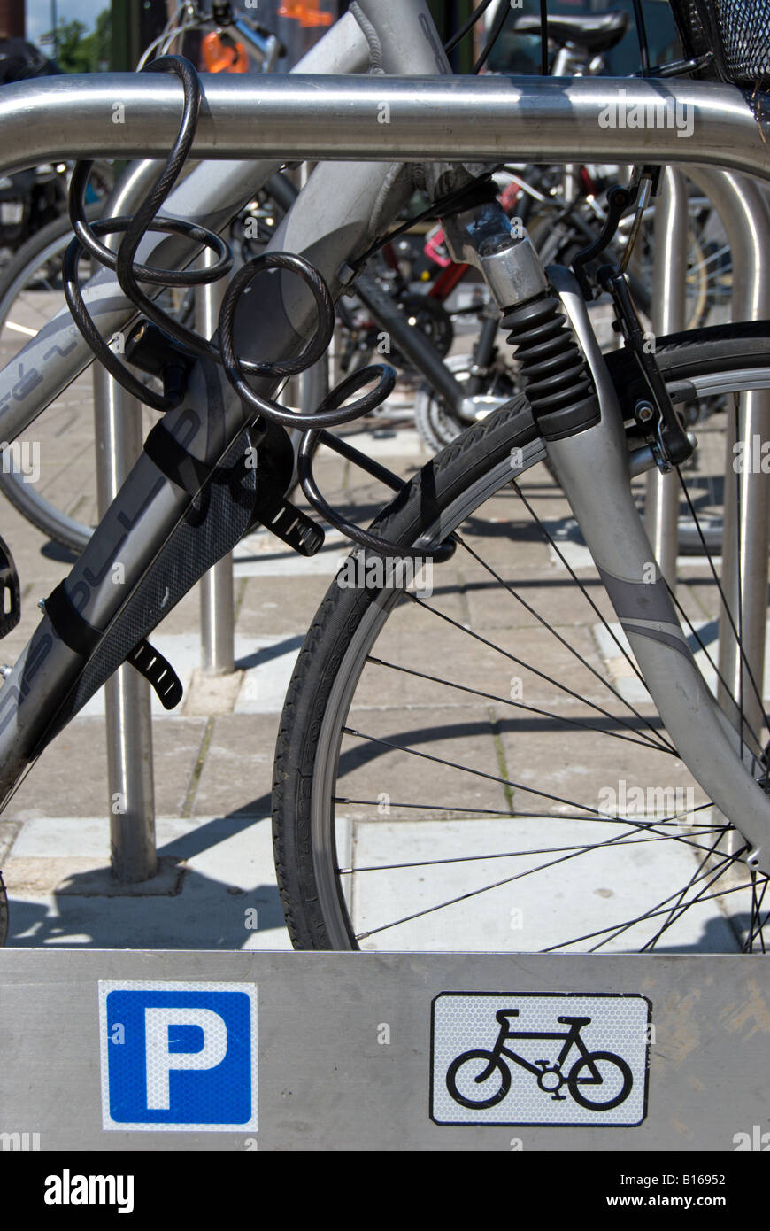 cycle parked at a council rack with cycle parking signs, in kingston
