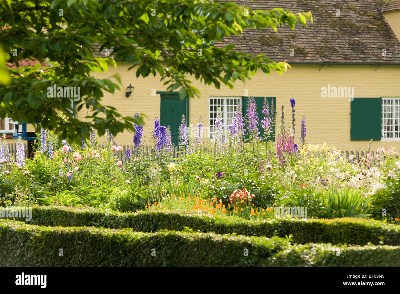 Peaceful english village house and garden; Summer flowers in an English village garden, Chippenham, Cambridgeshire UK Stock Photo