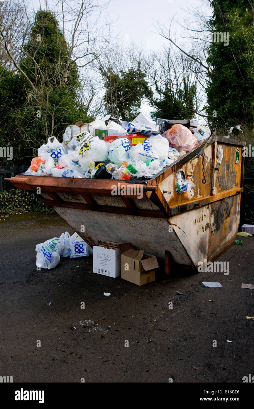 Overloaded recycling skip, full to top (rubbish & trash thrown away