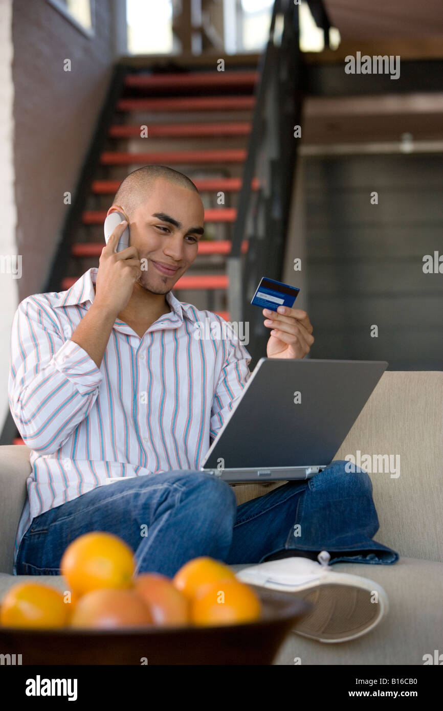 African American man shopping online Stock Photo