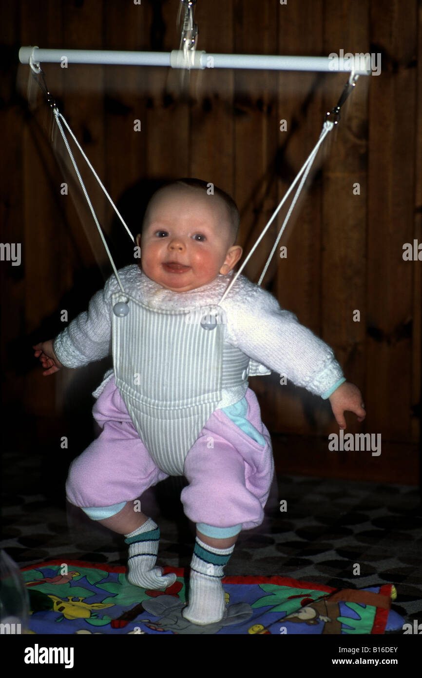 Baby in bouncer Stock Photo Alamy