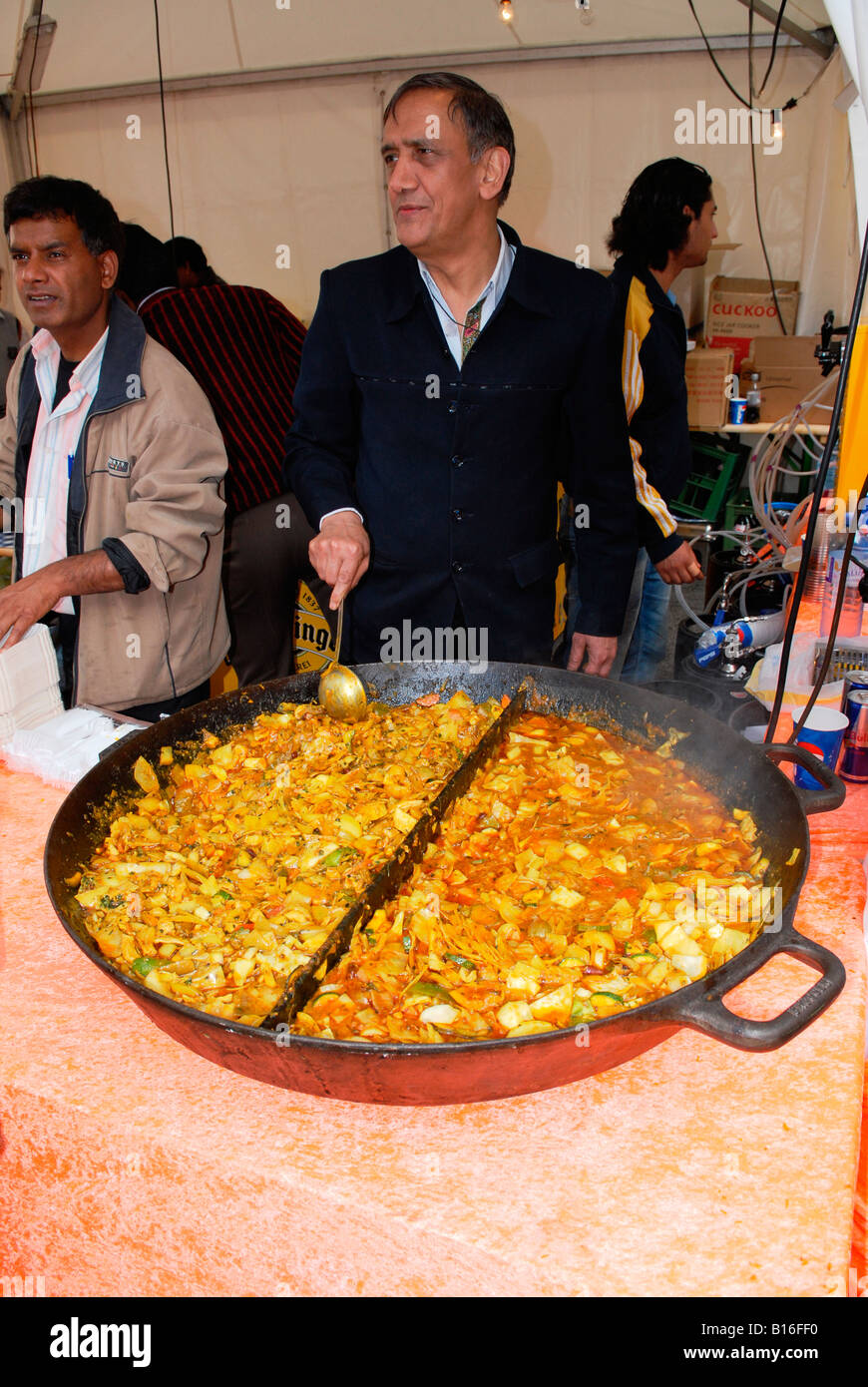 Wien Vienna city music festival oriental street or food stall with  mouthwatering Indian Asian food in split giant pan Stock Photo - Alamy