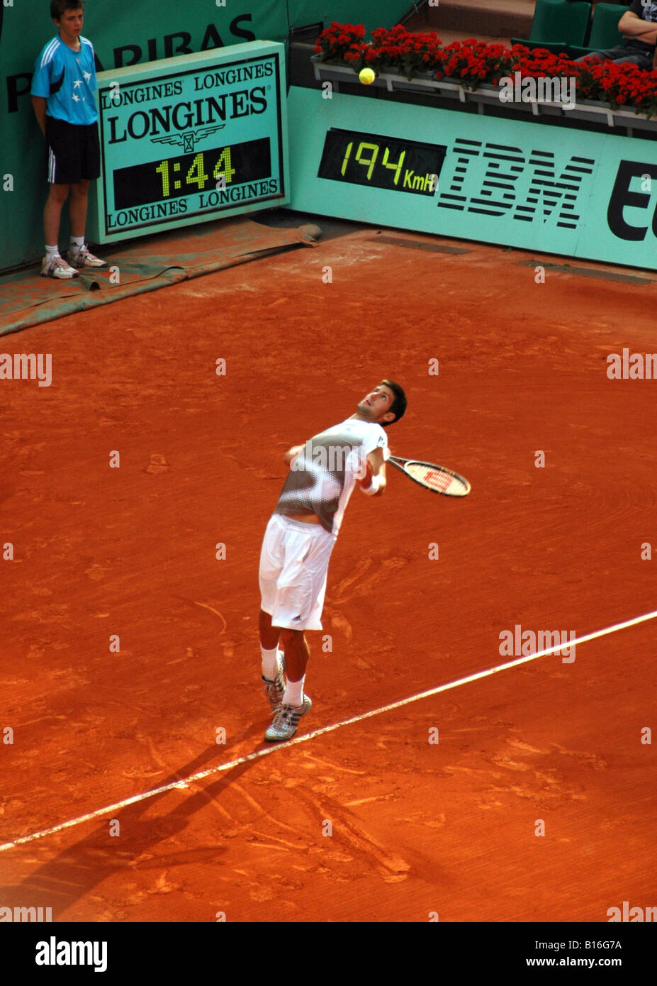 Novak Djokovic serving at Rolland Garros during the 2008 French Open tennis tournament Stock Photo
