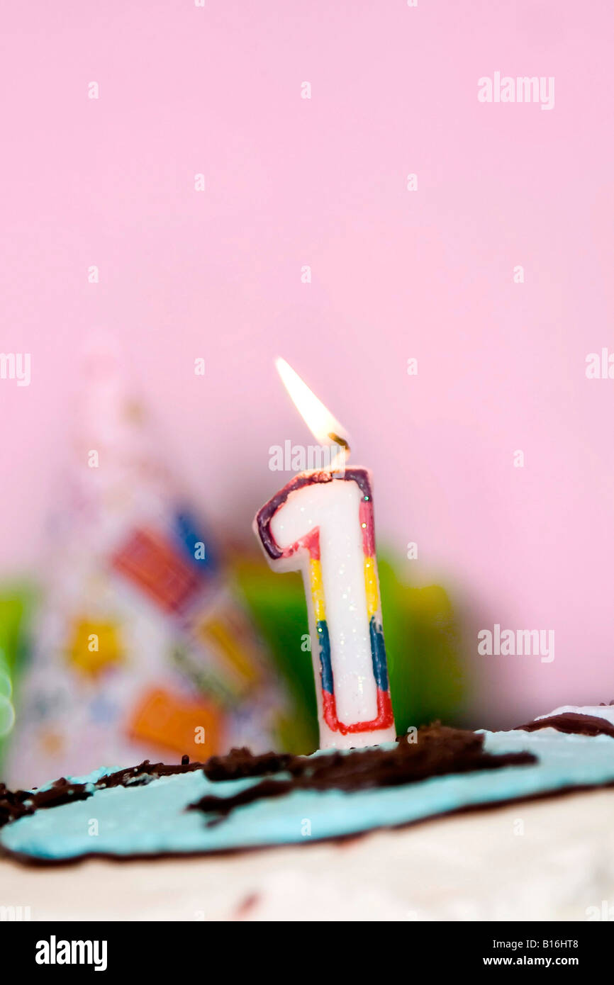 Birthday cake with a candle close up Stock Photo - Alamy
