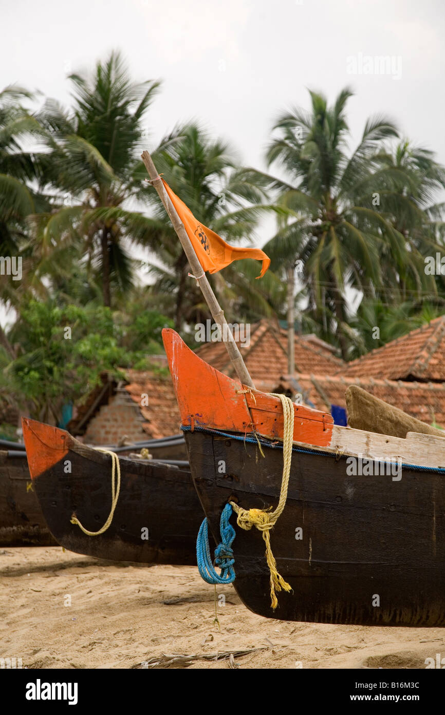 Kappil Beach in Kasaragod, Kerala. Fishing boats are pulled up on the beach. The prows can be seen here. Stock Photo