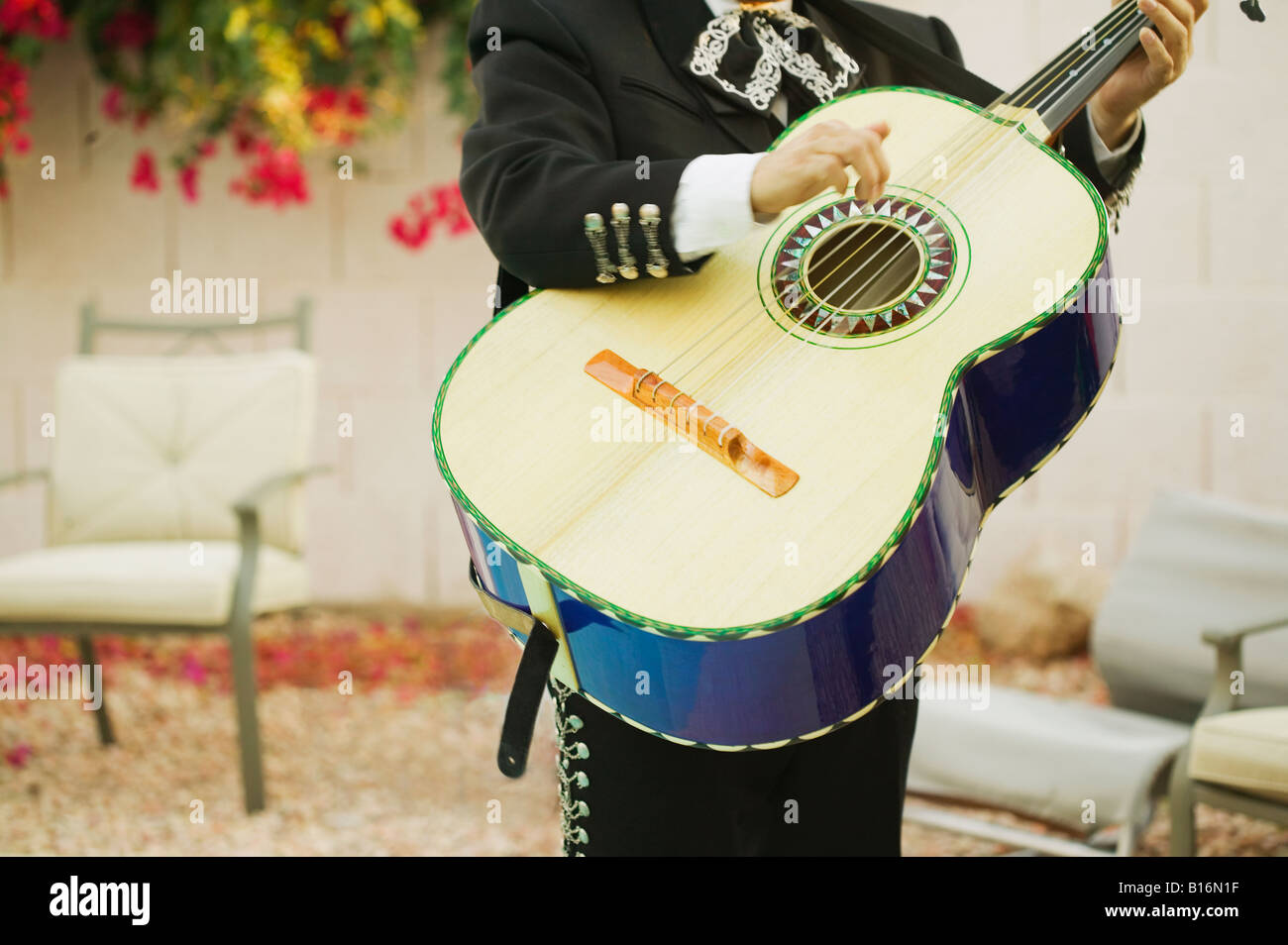 Mariachi band member holding guitar Stock Photo Alamy