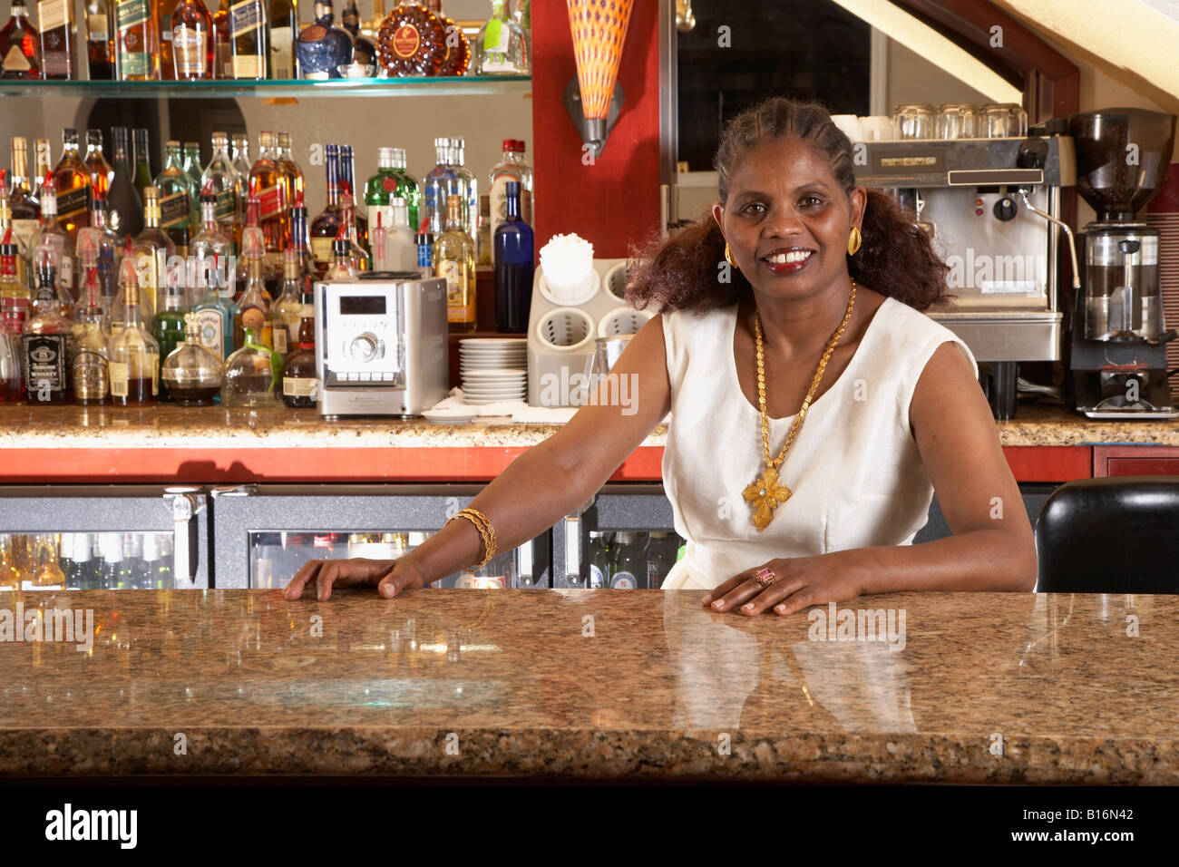 Portrait of African female bartender Stock Photo - Alamy