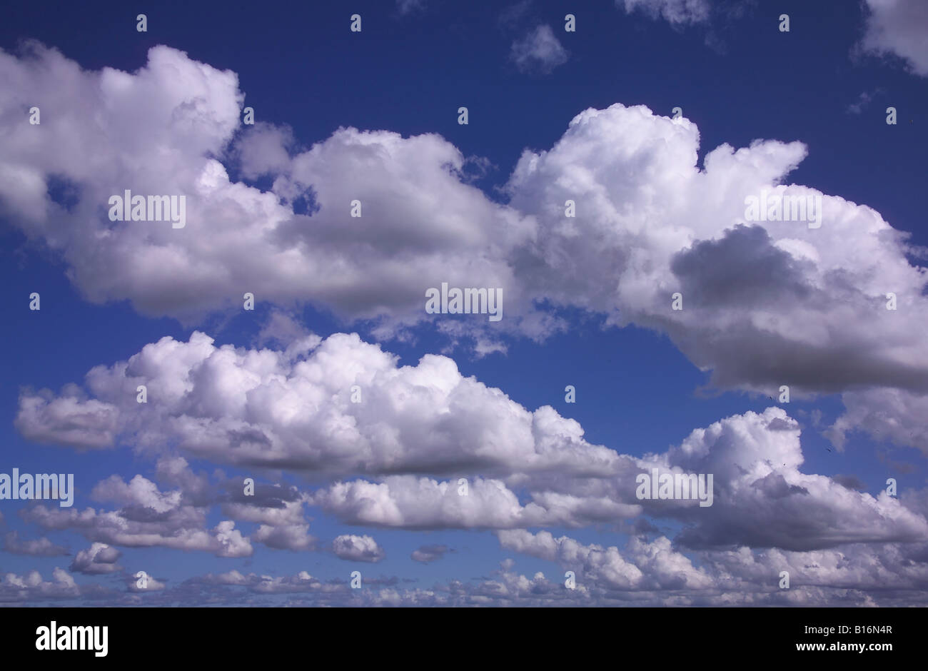 White clouds against a blue sky Stock Photo - Alamy