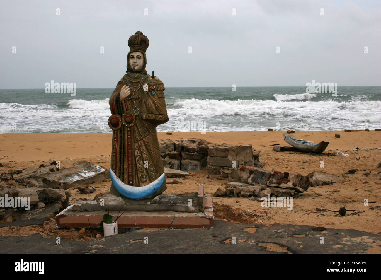 A religious statue of a saint from a destroyed church is placed on the