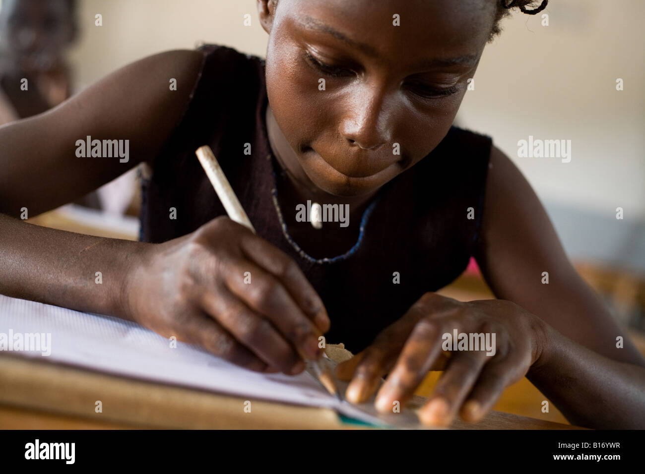 A girl draws in her notebook Stock Photo - Alamy
