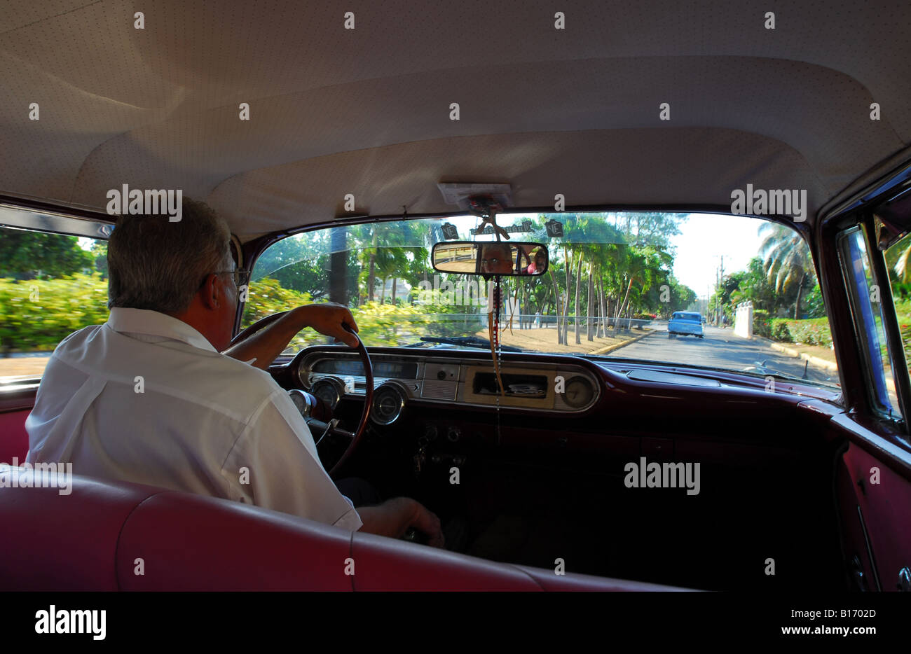 Interior view - Classic American Pontiac Star Chief car drives through Havana Cuba Stock Photo