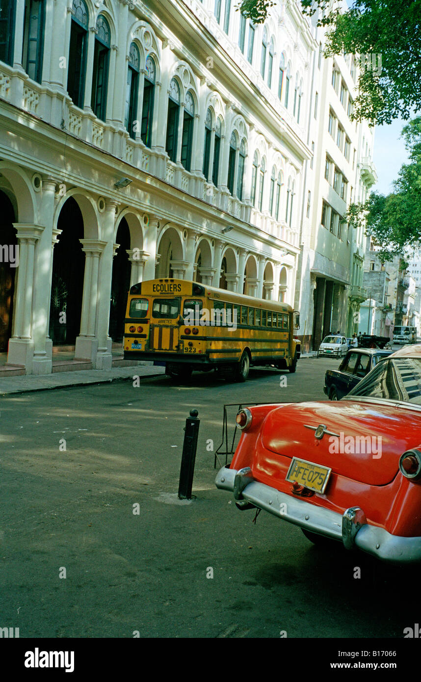 1950s car with school bus Old Town Havana Cuba Stock Photo