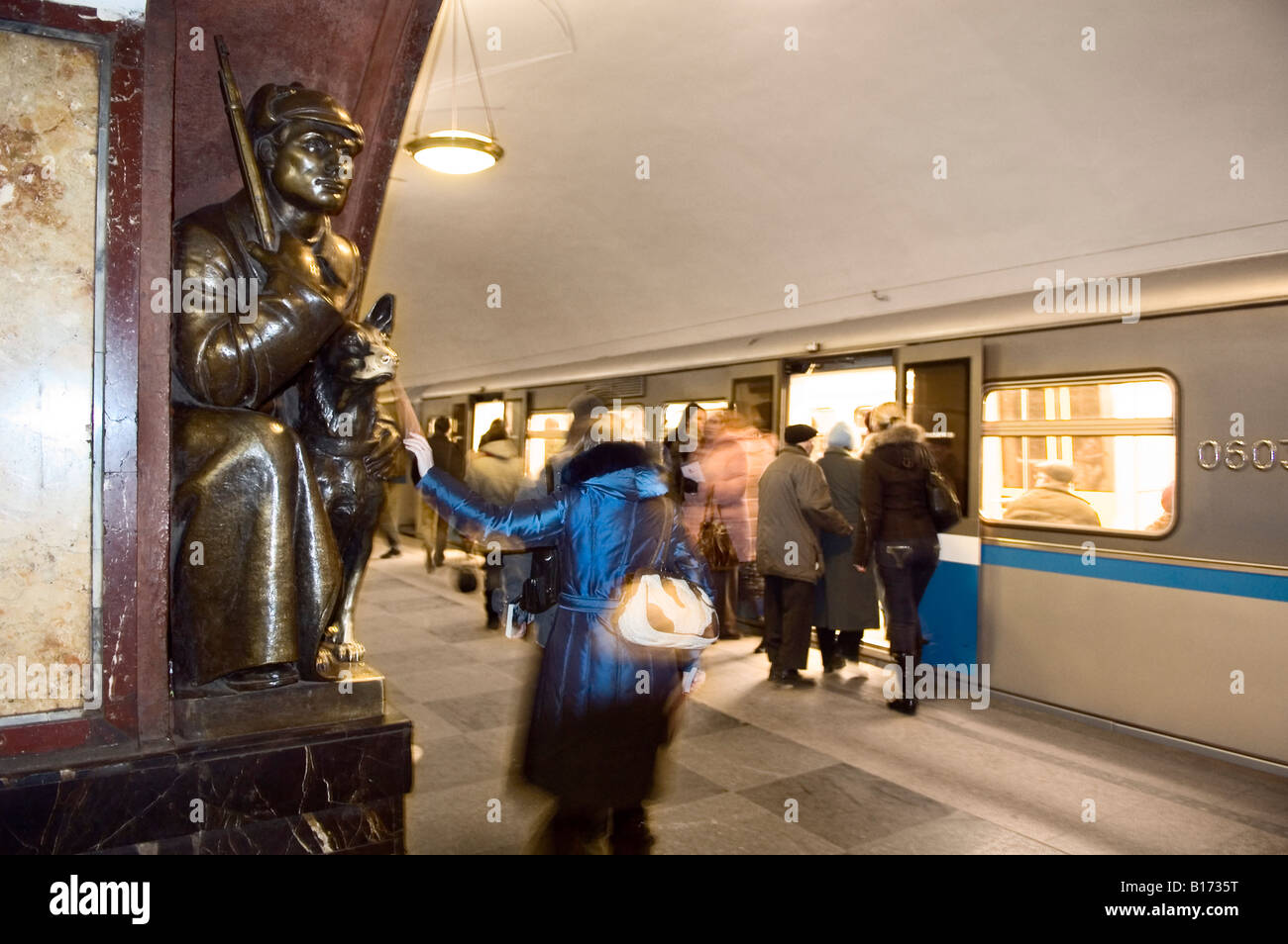Bronze statue of a border guard with his dog at Revolution Square metro