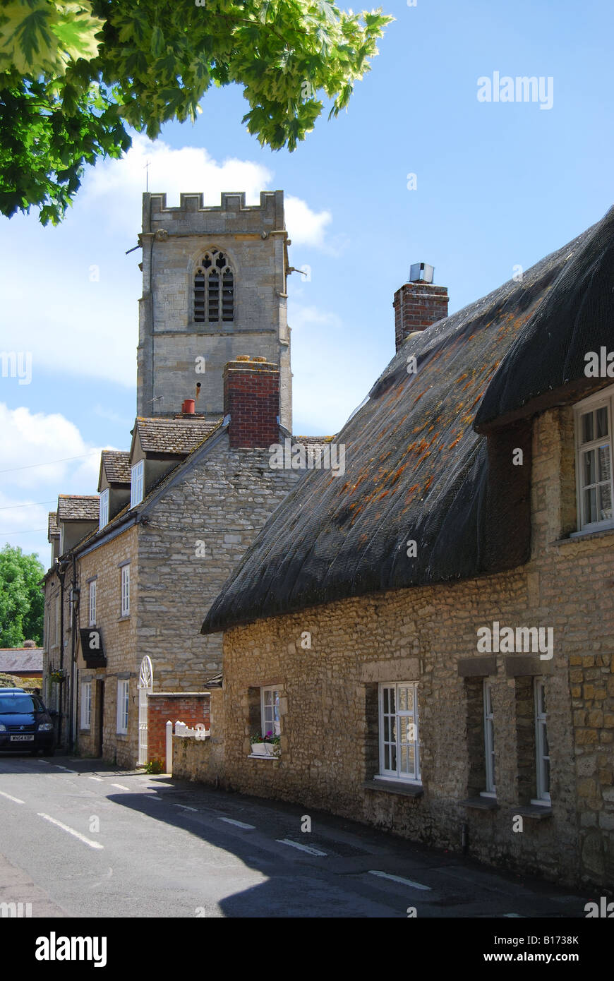 The Parish Church of St. Leonard's and cottages, Eynsham, Cotswolds, Oxfordshire, England, United Kingdom Stock Photo