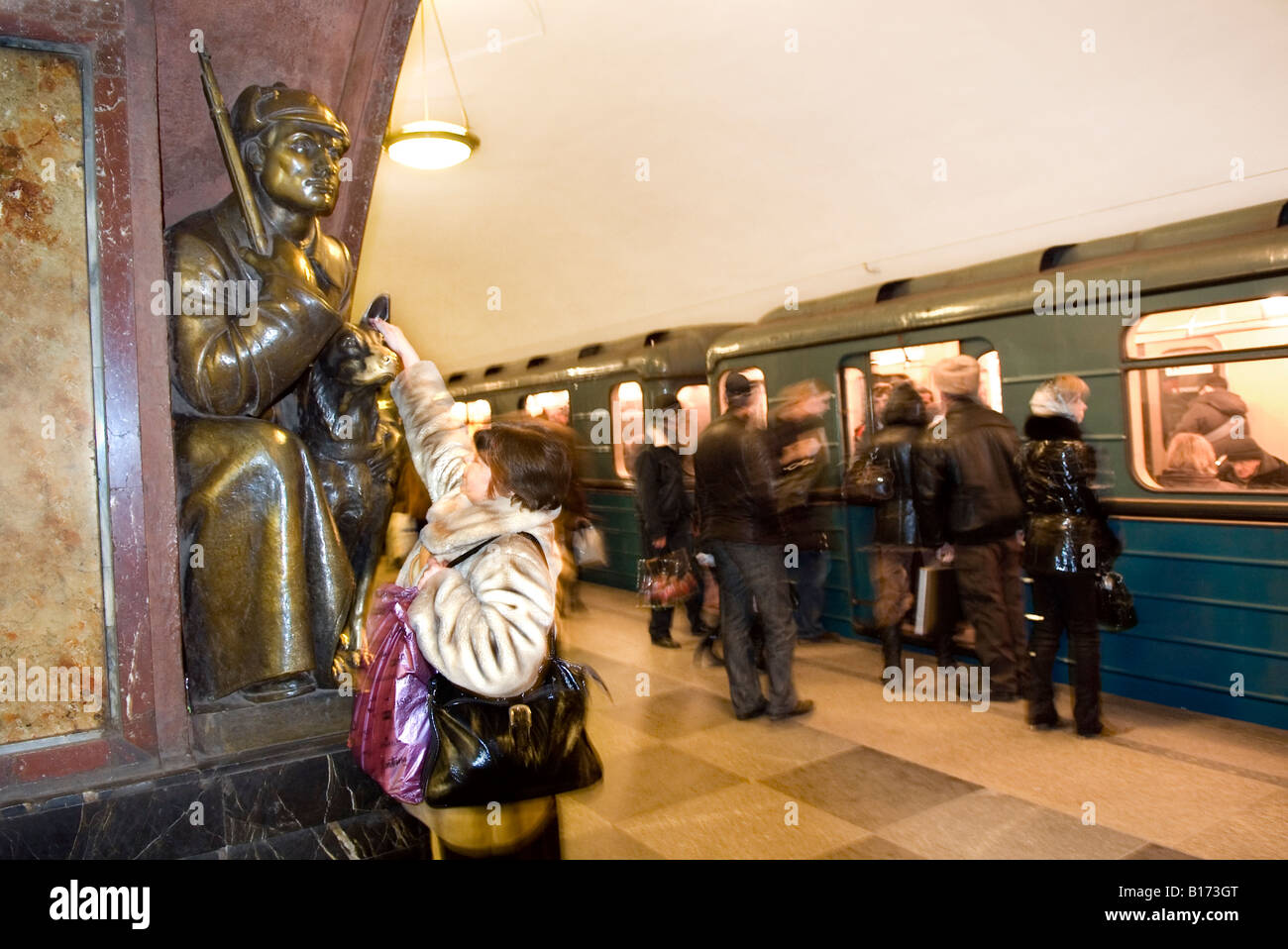 Bronze statue of a border guard with his dog at Revolution Square metro
