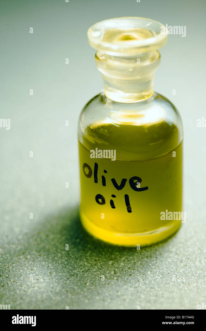 Olive oil in small glass bottle Sample taken from organically grown