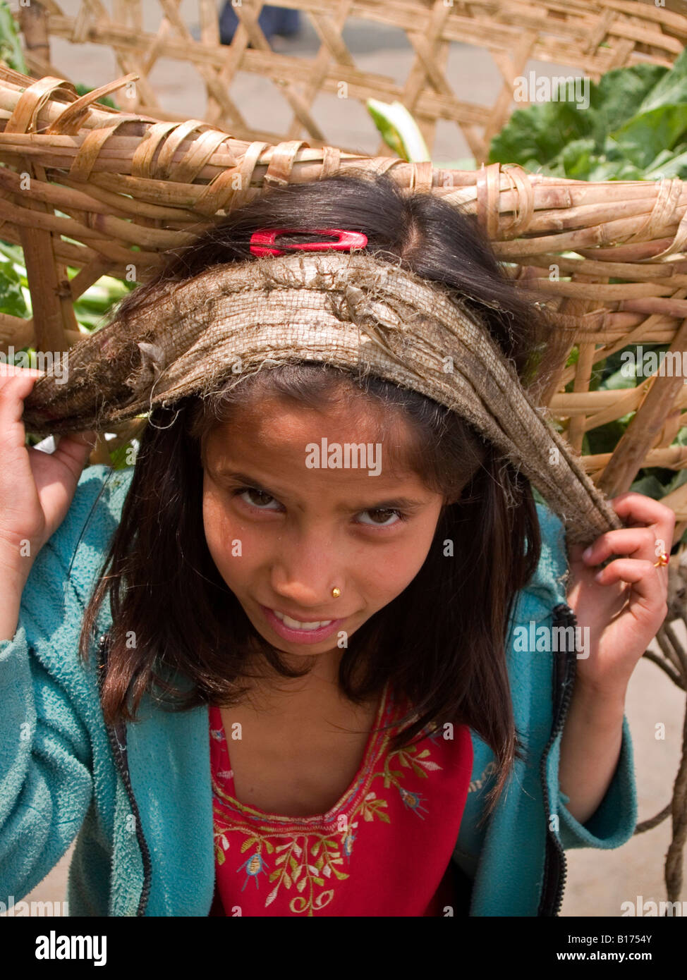 Nepali girl with her basket Stock Photo