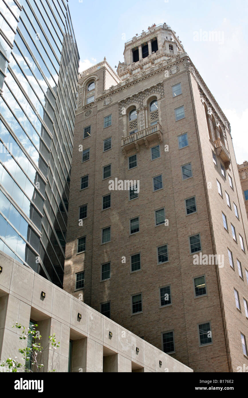 Original Plumber building dwarfed by skyscraper Mayo medical complex Rochester Minnesota Stock Photo