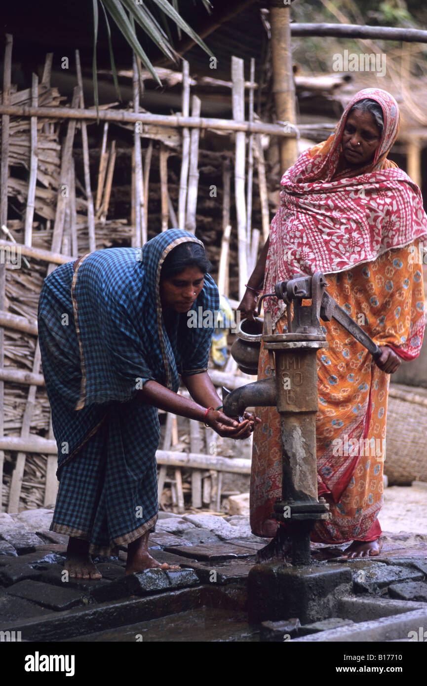 women at a water pump rural Bangladesh Village Stock Photo Alamy