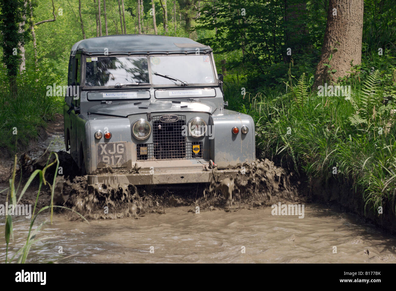 Grey Series 2 Land Rover at the ALRC National 2008 RTV Trial driving through flooded forest road after torrential rain. Stock Photo