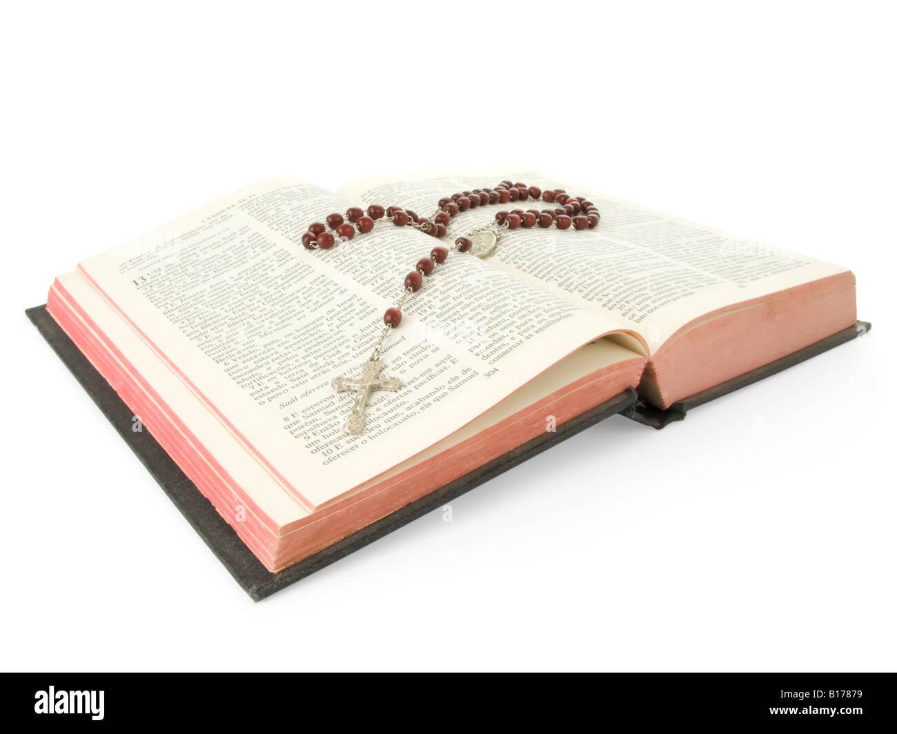 Rosary over an old holy bible Stock Photo
