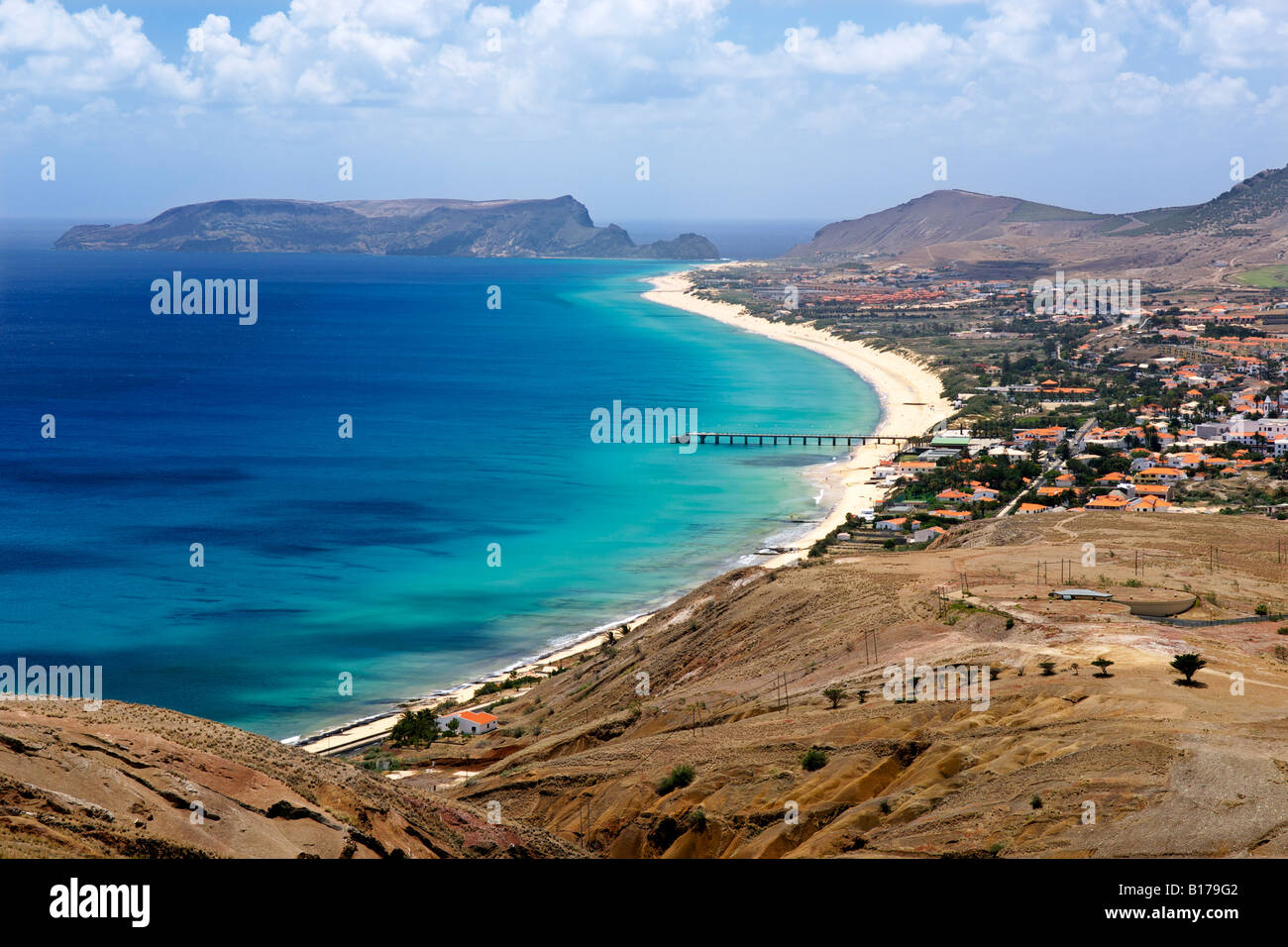 View of the beach and town of Vila Baleira seen from the Portela lookout point on the Portuguese Atlantic island of Porto Santo. Stock Photo