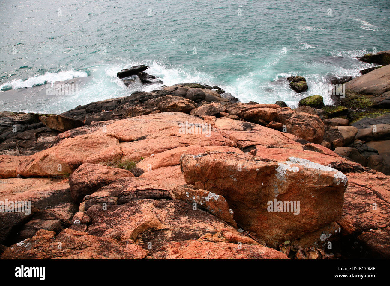 Indian Red Rocks Red rocks at kovalam beach,kerala,india Stock Photo - Alamy