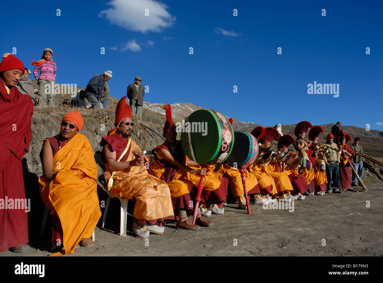 Buddhist monks of Sakya sect at the ceremony to crown the head monk lama at Komik monastery. Spiti, Himachal Pradesh, India. Stock Photo
