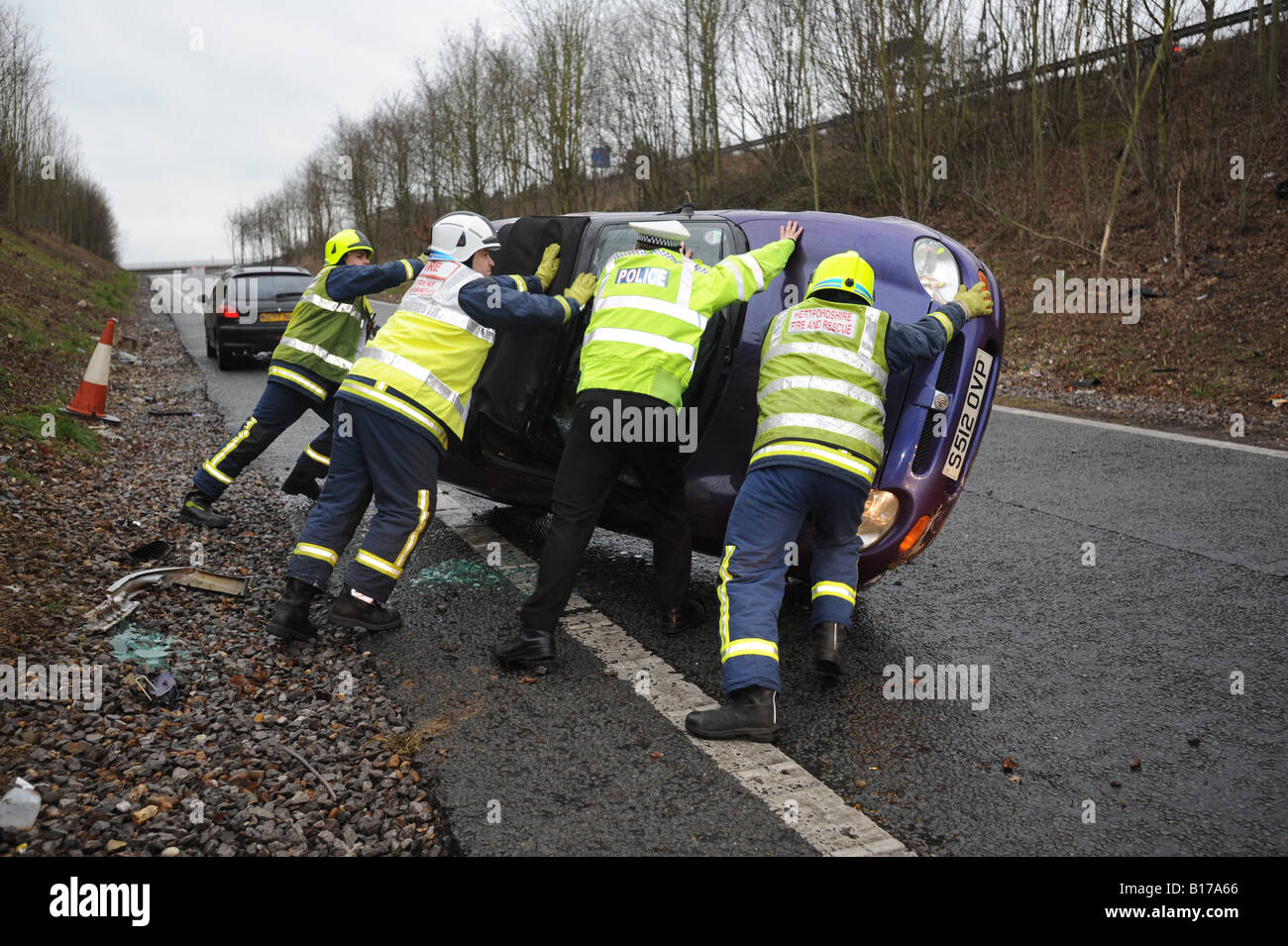 Road Traffic Accident where young Female driver skidded and rolled her car over on the M25 Motorway in Hertfordshire UK Stock Photo