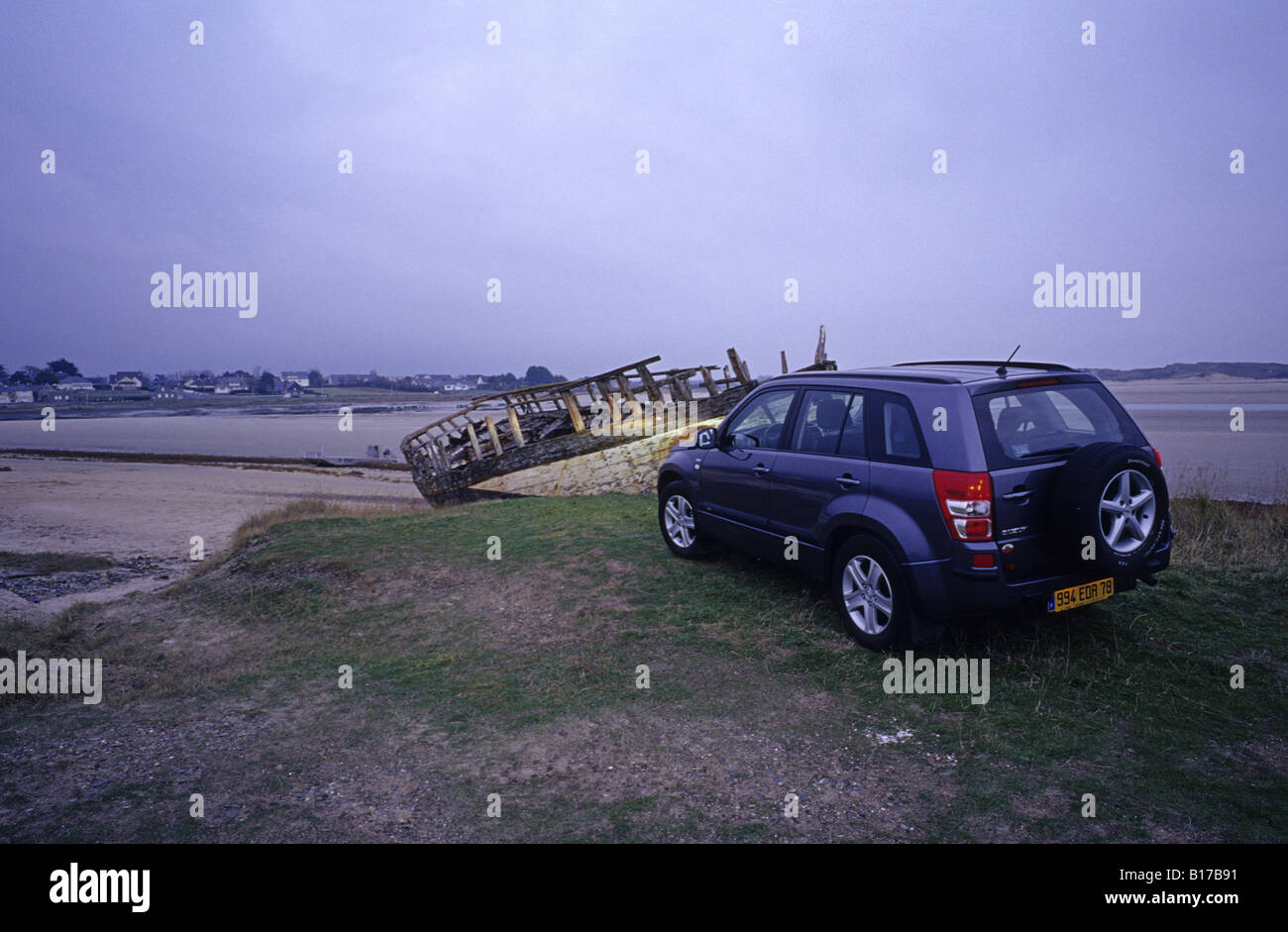 Portbail Normandy Suzuki Grand Vitara and ship wreck Stock Photo