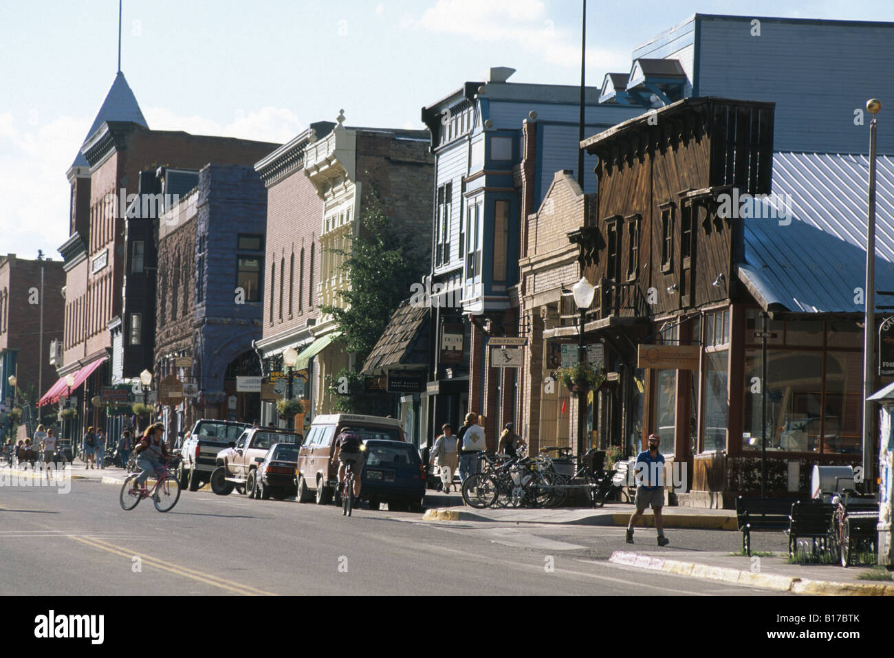 Bicyclists and pedestrians on the main street in Telluride Colorado USA Stock Photo