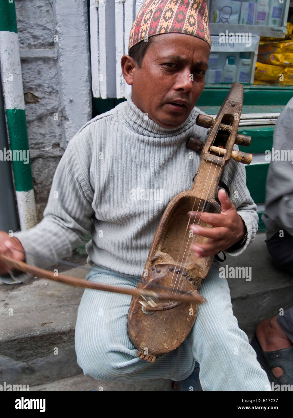 Nepali playing traditional instrument Stock Photo Alamy