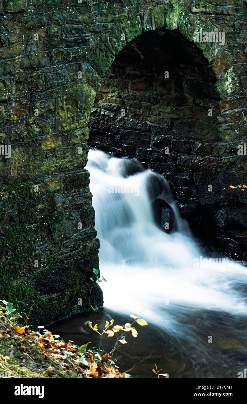Rushing water under archway, Pennines, England Stock Photo - Alamy