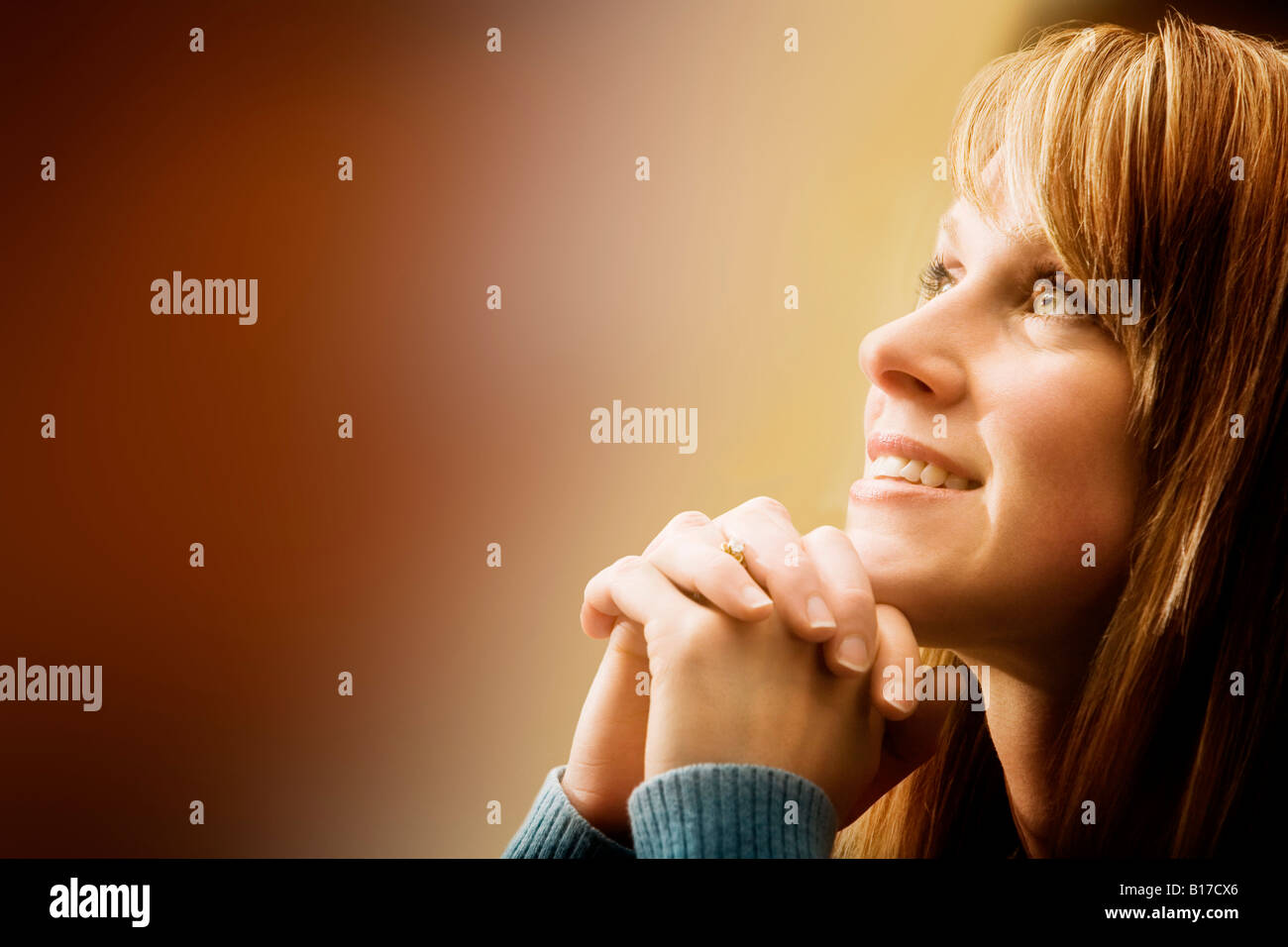 Woman looking upwards Stock Photo