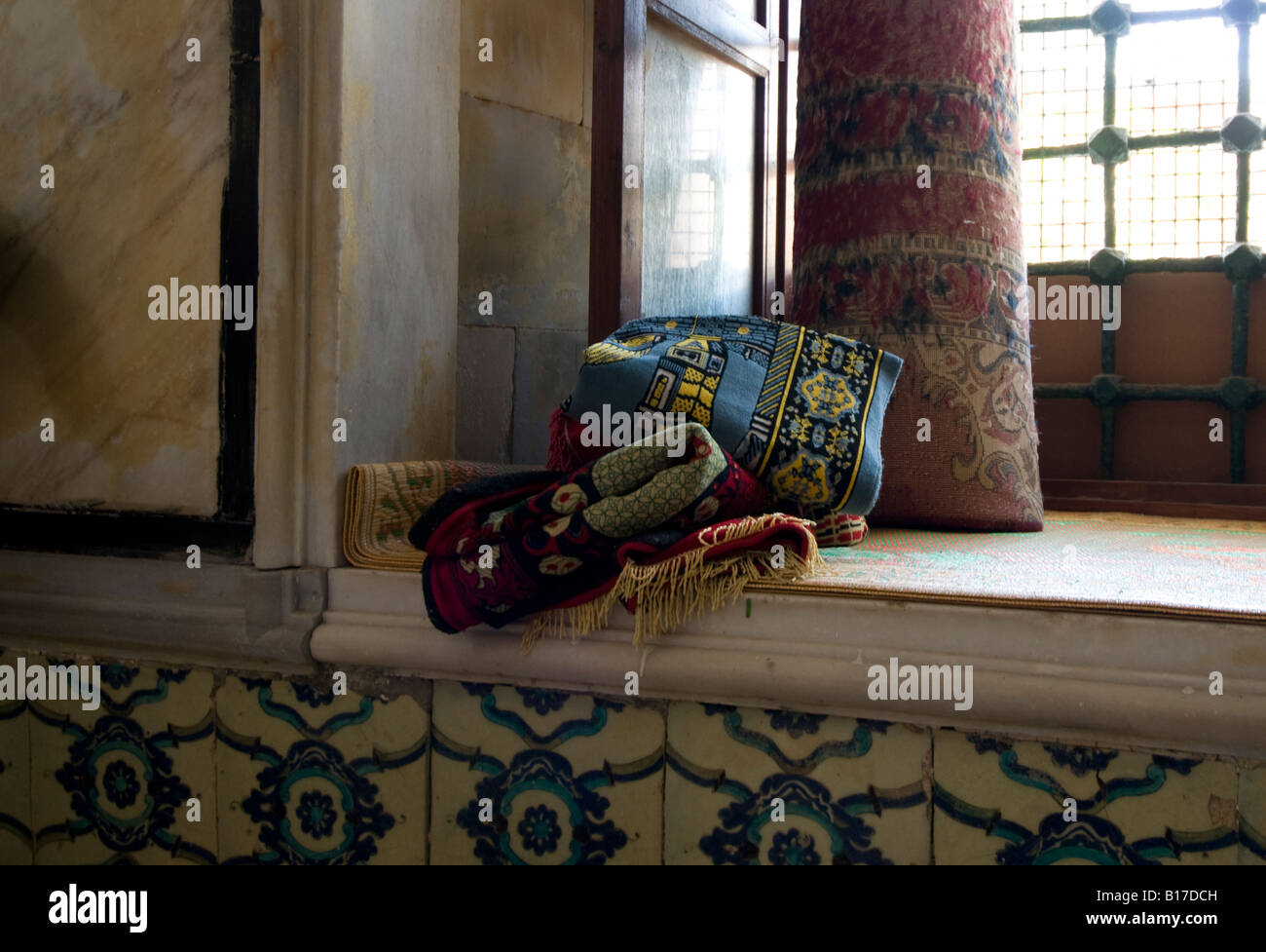 Folded prayer rugs in the El Jazzar mosque, Acre (Akko), Northern Israel Stock Photo