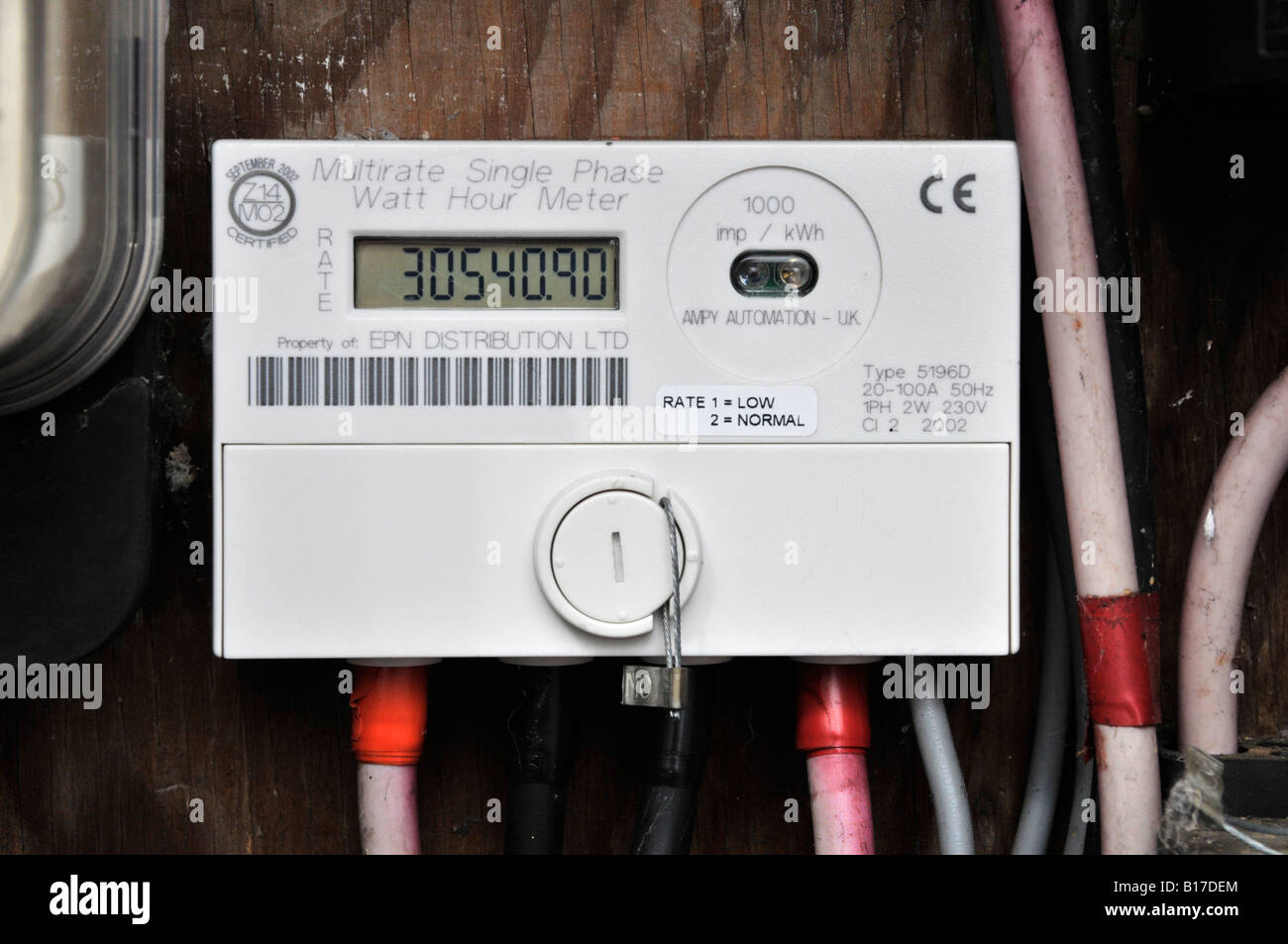Close up sealed domestic home multirate single phase electricity meter measuring dual rate economy 7 & normal energy consumption readings England UK Stock Photo