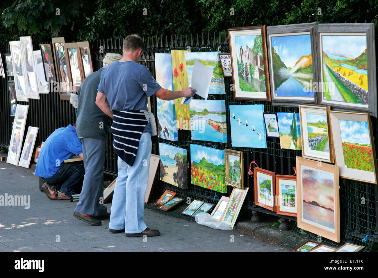 Art and paintings on sale by Irish artists on a street sidewalk
