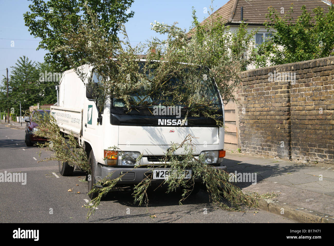 Gardeners van with twigs hung on the side Stock Photo Alamy